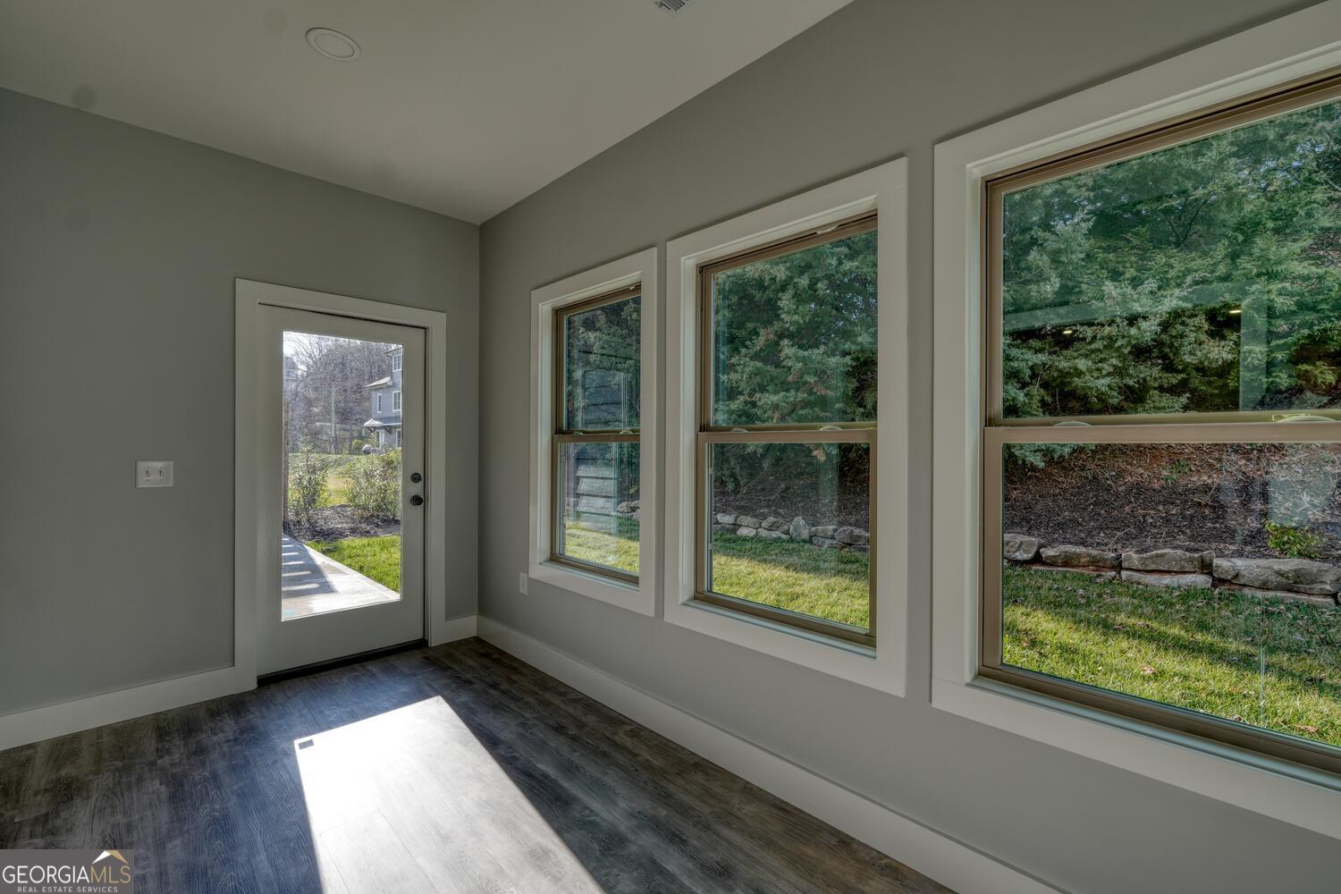 98 Brett Way, Unit F Hiawassee, GA 30546 - Photo 21 of 40 a view of an entryway with wooden floor and windows