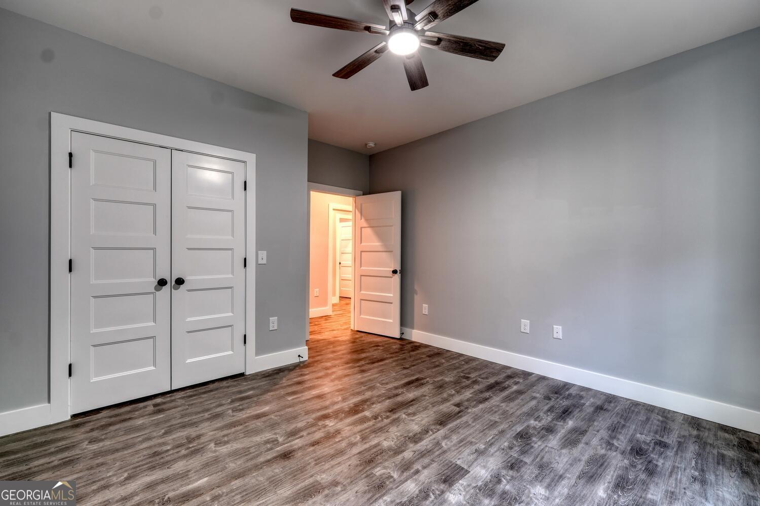 98 Brett Way, Unit F Hiawassee, GA 30546 - Photo 25 of 40 wooden floor in an empty room with a window