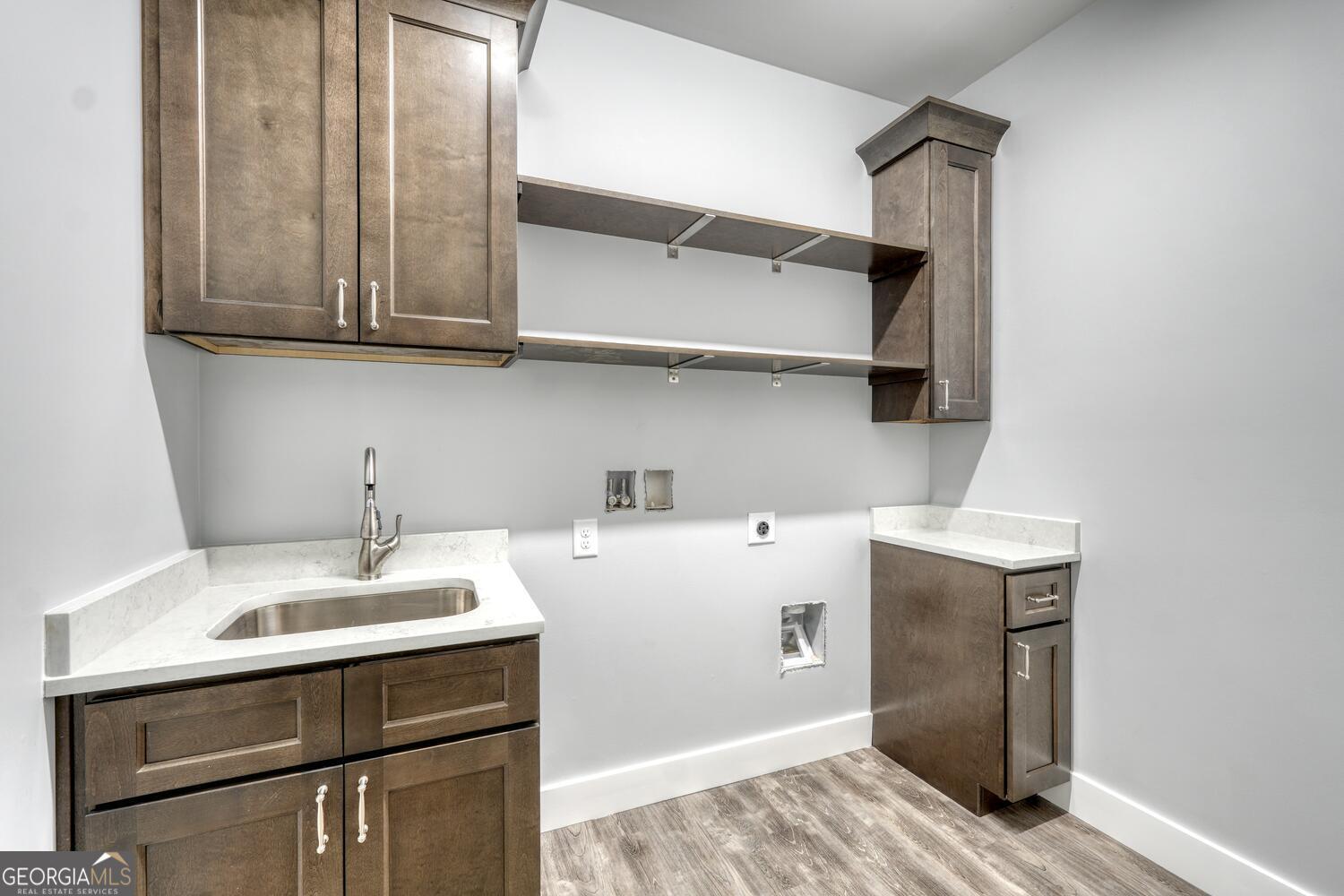 98 Brett Way, Unit F Hiawassee, GA 30546 - Photo 29 of 40 a room with a sink cabinets and utility
