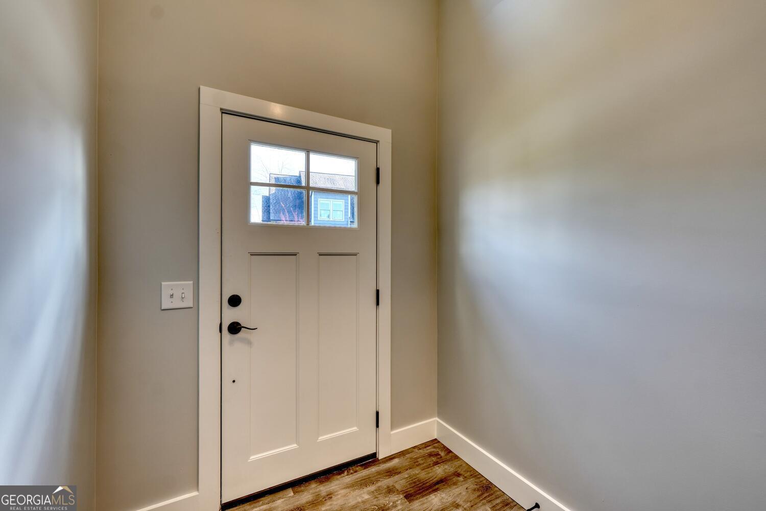 98 Brett Way, Unit F Hiawassee, GA 30546 - Photo 6 of 40 a view of front door with wooden floor