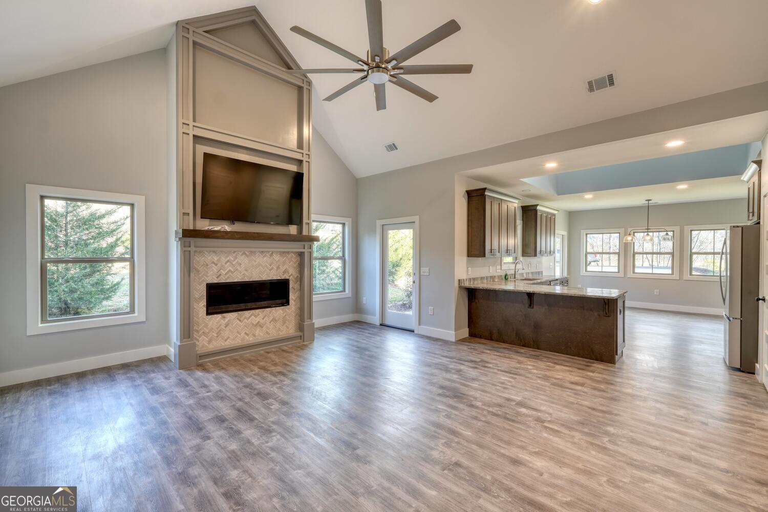 98 Brett Way, Unit F Hiawassee, GA 30546 - Photo 10 of 40 a view of kitchen and living room with wooden floor