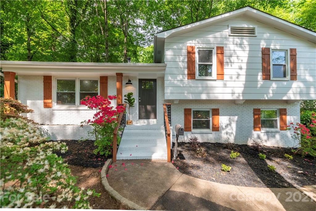 7316 Watercrest Road Charlotte, NC 28210 - Photo 1 of 28 a front view of a house with a porch