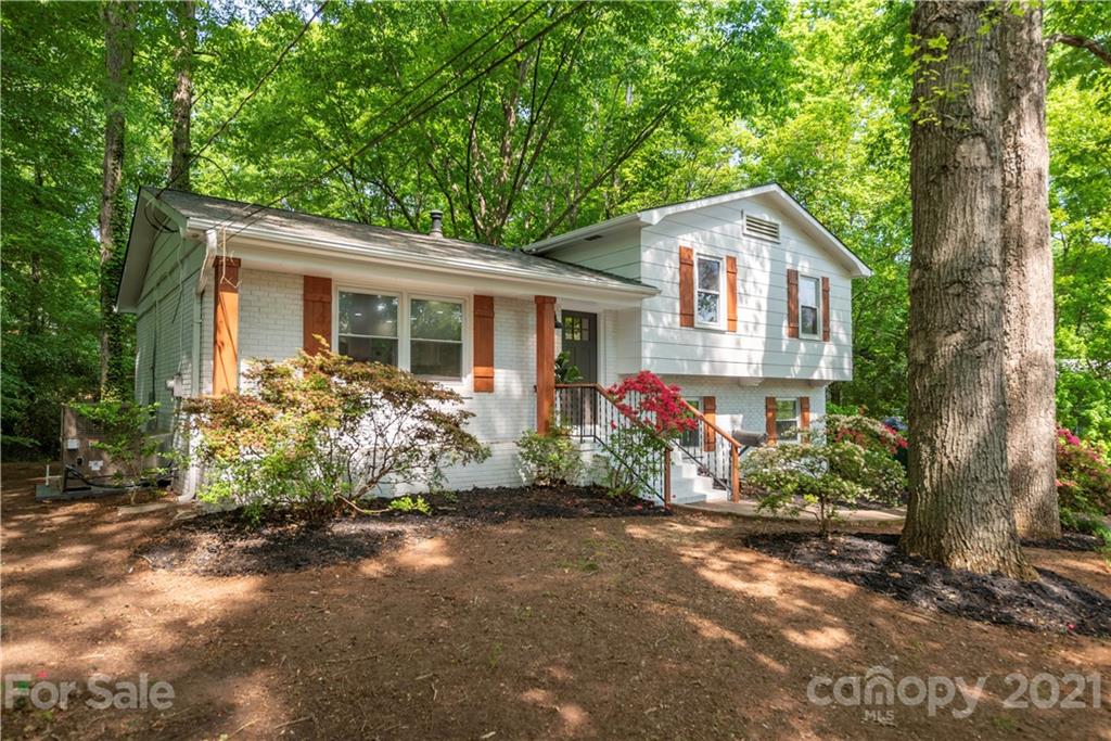 7316 Watercrest Road Charlotte, NC 28210 - Photo 2 of 28 a front view of house with yard and trees around