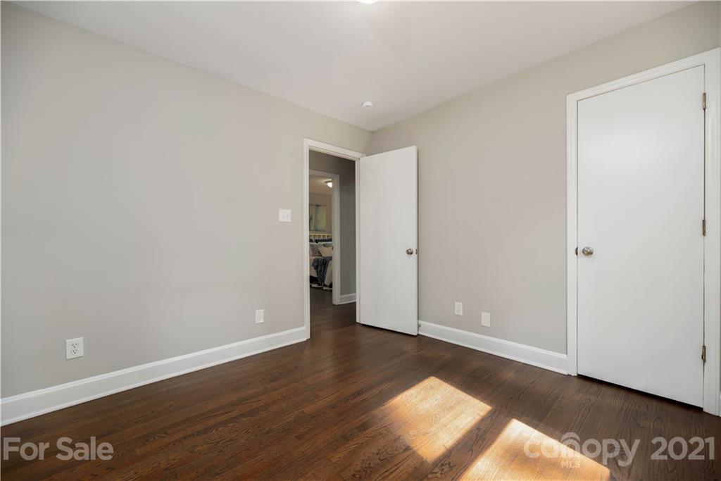 7316 Watercrest Road Charlotte, NC 28210 - Photo 20 of 28 a view of an empty room with wooden floor