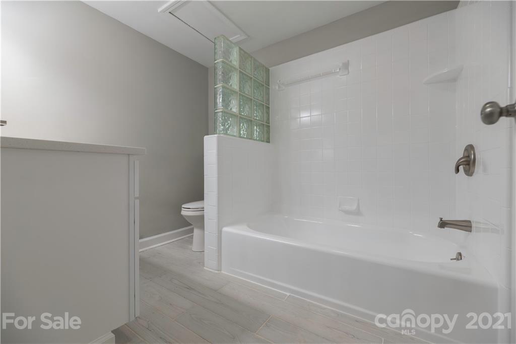 7316 Watercrest Road Charlotte, NC 28210 - Photo 27 of 28 a bathroom with a bathtub and a toilet