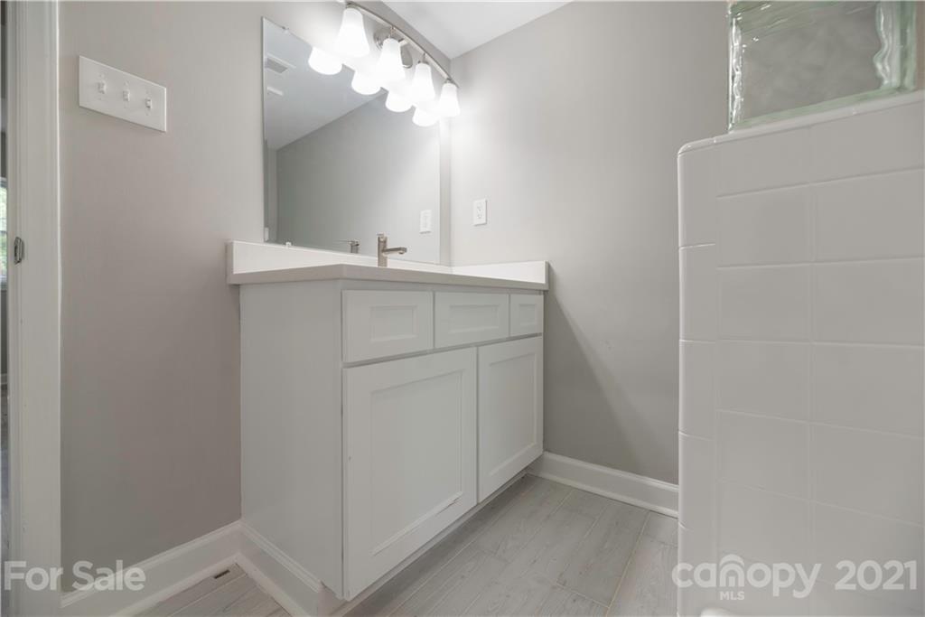 7316 Watercrest Road Charlotte, NC 28210 - Photo 28 of 28 a room with a sink and a mirror