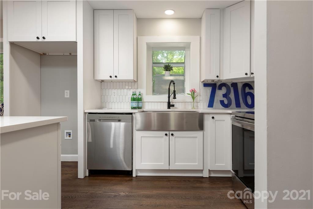 7316 Watercrest Road Charlotte, NC 28210 - Photo 6 of 28 a kitchen with stainless steel appliances a sink a stove a refrigerator and cabinets