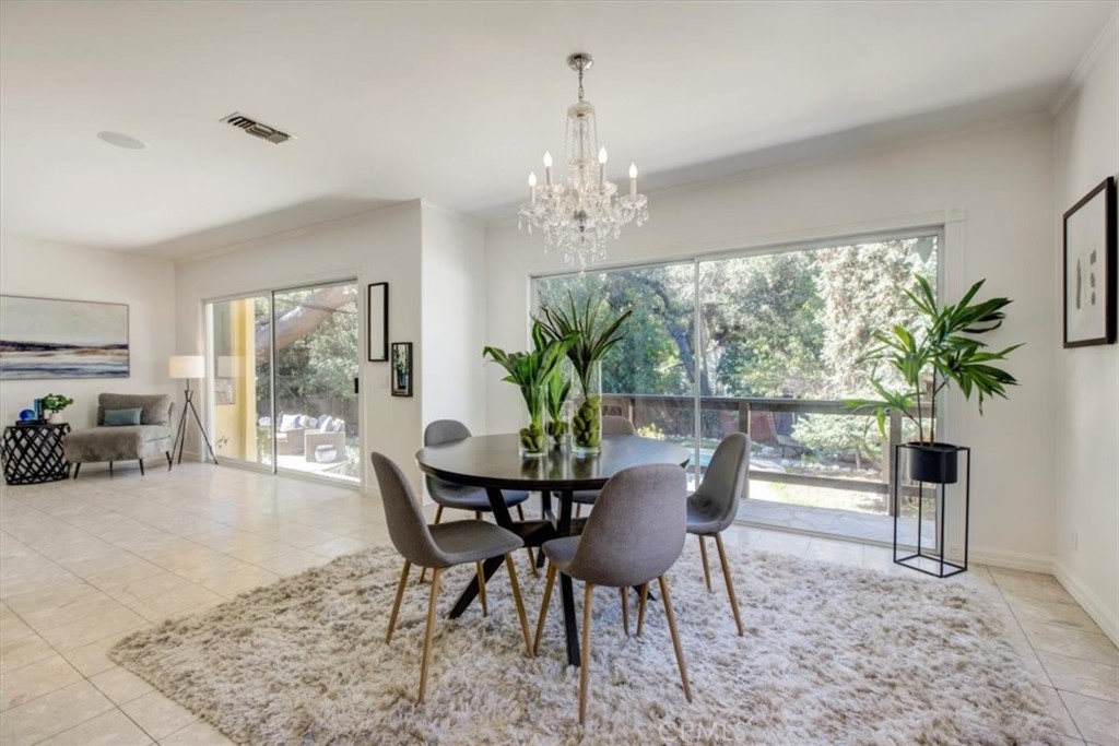 1980 El Arbolita Drive Glendale, CA 91208 - Photo 11 of 43 a view of a dining room with furniture window and outside view