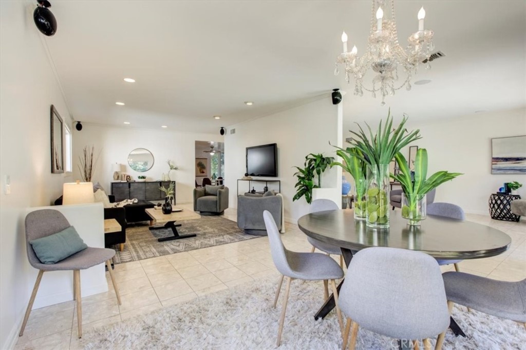 1980 El Arbolita Drive Glendale, CA 91208 - Photo 12 of 43 a living room with furniture flowerpot and a chandelier