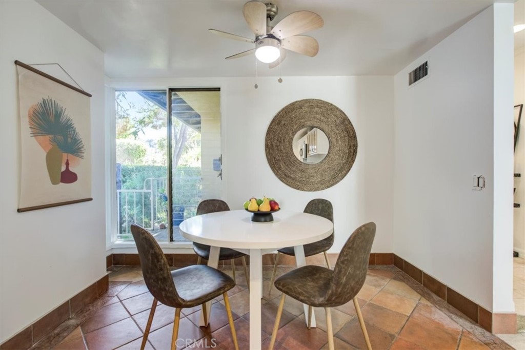 1980 El Arbolita Drive Glendale, CA 91208 - Photo 16 of 43 a dining room with furniture and a large window