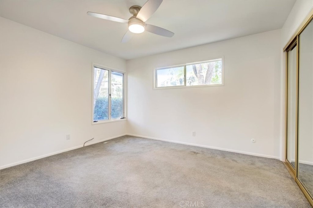 1980 El Arbolita Drive Glendale, CA 91208 - Photo 18 of 43 an empty room with a window and a ceiling fan
