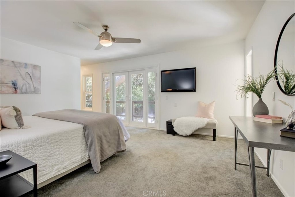 1980 El Arbolita Drive Glendale, CA 91208 - Photo 23 of 43 a bedroom with a bed and a flat screen tv