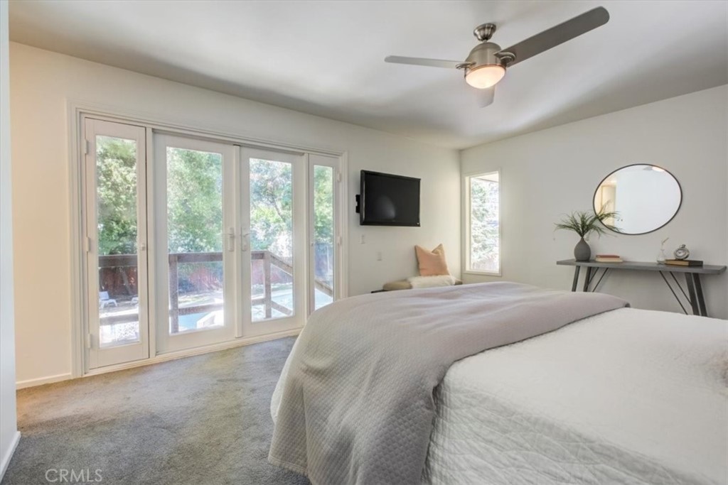 1980 El Arbolita Drive Glendale, CA 91208 - Photo 26 of 43 a bedroom with a large bed and a large window