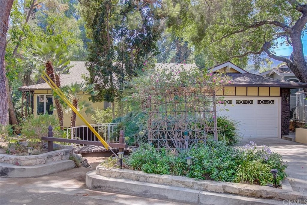 1980 El Arbolita Drive Glendale, CA 91208 - Photo 3 of 43 a front view of a house with a yard