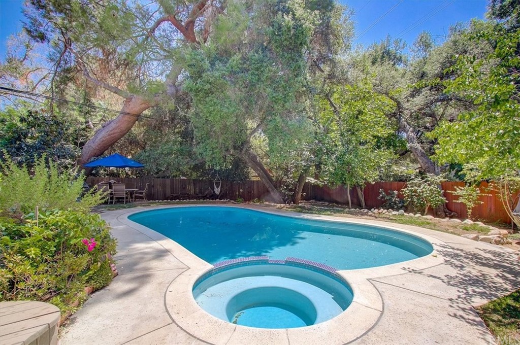 1980 El Arbolita Drive Glendale, CA 91208 - Photo 32 of 43 a view of a swimming pool with a yard