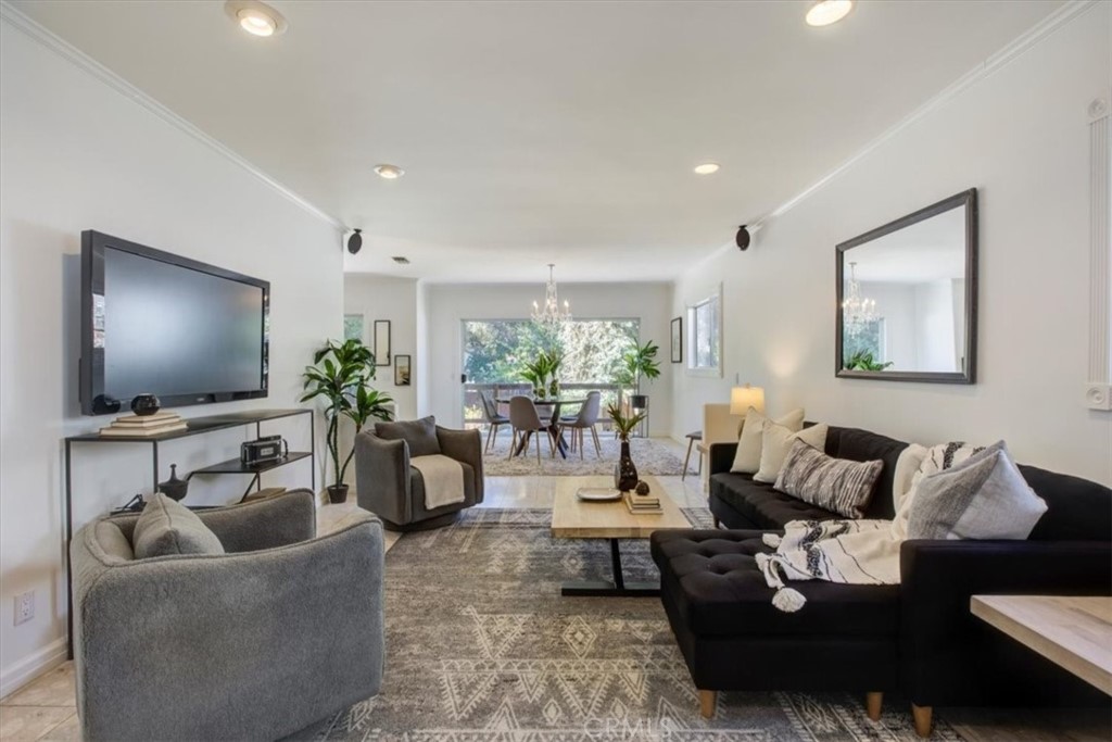 1980 El Arbolita Drive Glendale, CA 91208 - Photo 6 of 43 a living room with furniture and a flat screen tv