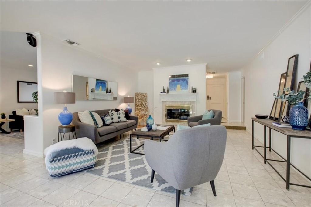 1980 El Arbolita Drive Glendale, CA 91208 - Photo 9 of 43 a living room with furniture and a fireplace