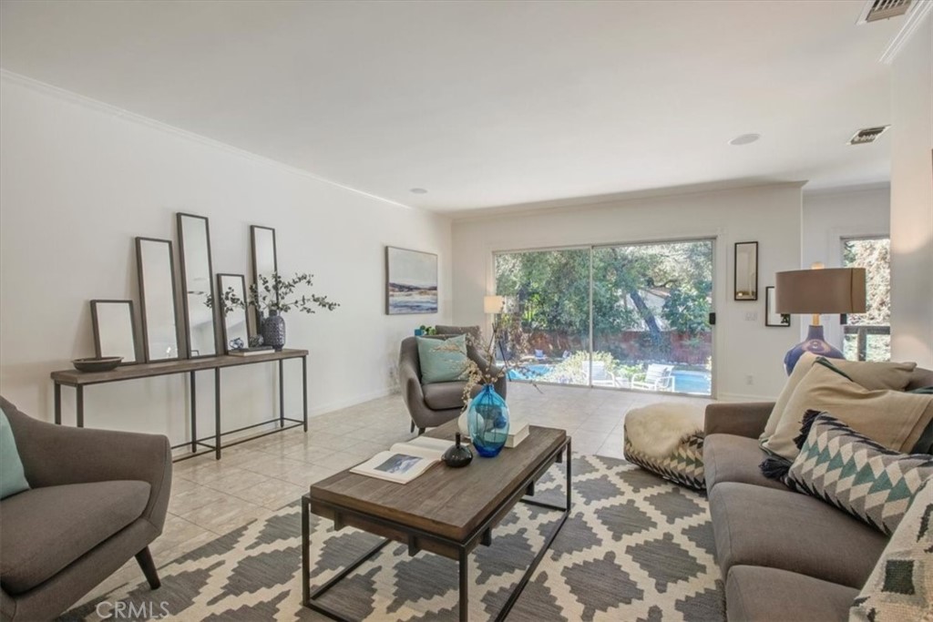 1980 El Arbolita Drive Glendale, CA 91208 - Photo 10 of 43 a living room with furniture and a window