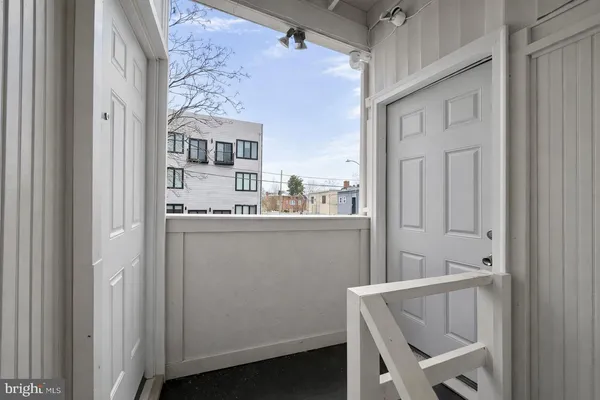 a view of a backyard with a tree