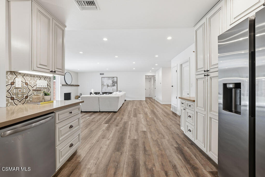 1772 Fred Avenue Simi Valley, CA 93065 - Photo 14 of 43 a large white kitchen with cabinets