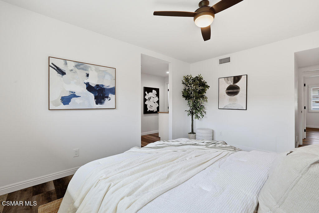 1772 Fred Avenue Simi Valley, CA 93065 - Photo 23 of 43 a bedroom with a large bed and a chandelier