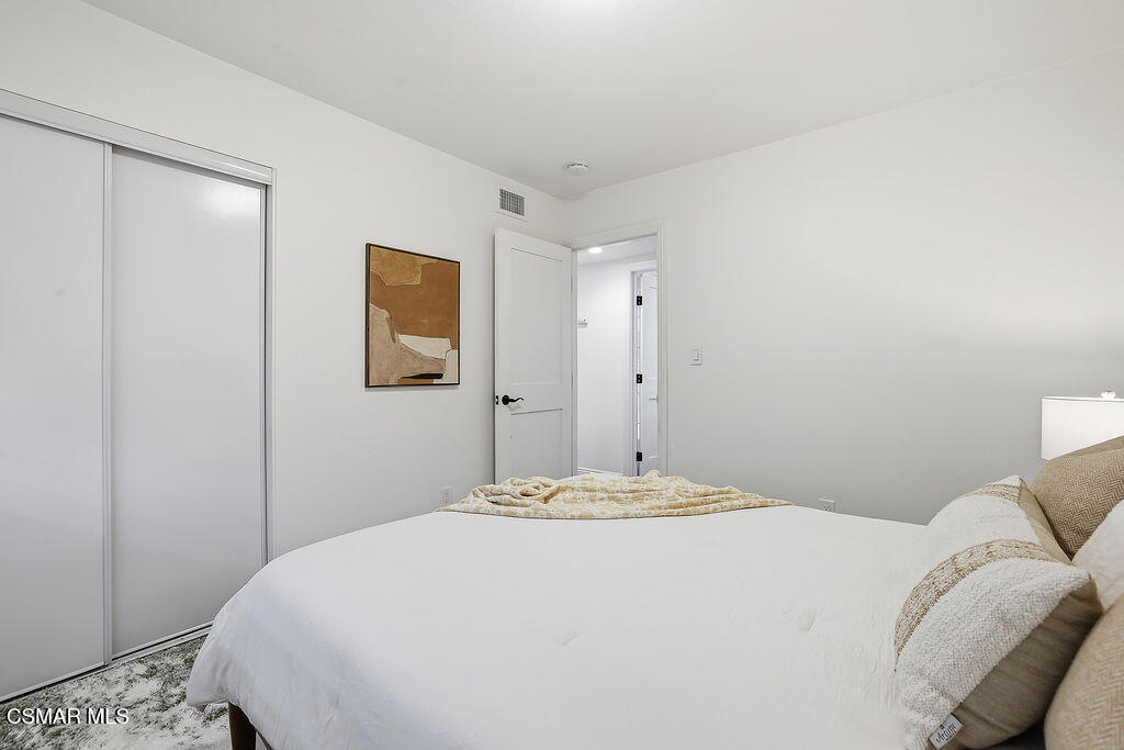 1772 Fred Avenue Simi Valley, CA 93065 - Photo 29 of 43 a bedroom with a bed and a painting on the wall