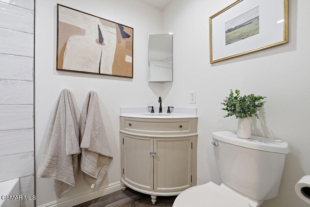 1772 Fred Avenue Simi Valley, CA 93065 - Photo 30 of 43 a bathroom with a toilet sink and mirror