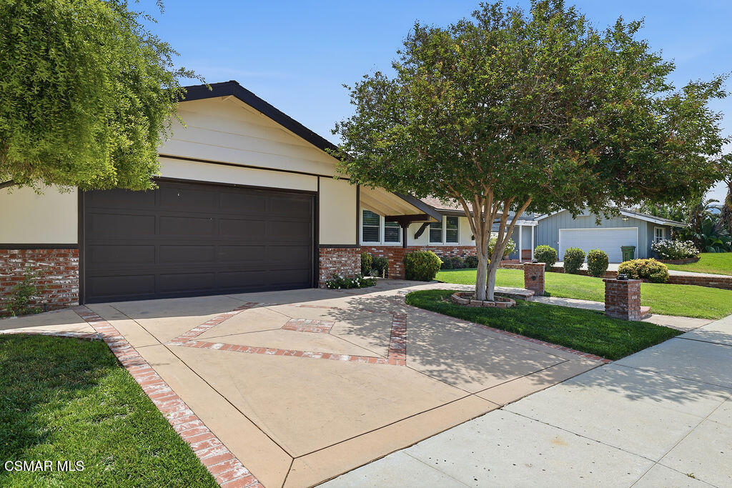 1772 Fred Avenue Simi Valley, CA 93065 - Photo 4 of 43 a front view of a house with a yard and garage