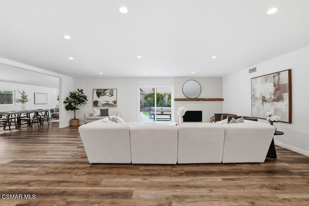 1772 Fred Avenue Simi Valley, CA 93065 - Photo 6 of 43 a living room with furniture a fireplace and wooden floor