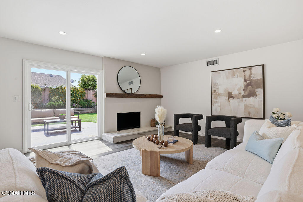 1772 Fred Avenue Simi Valley, CA 93065 - Photo 7 of 43 a living room with furniture a fireplace and a large window