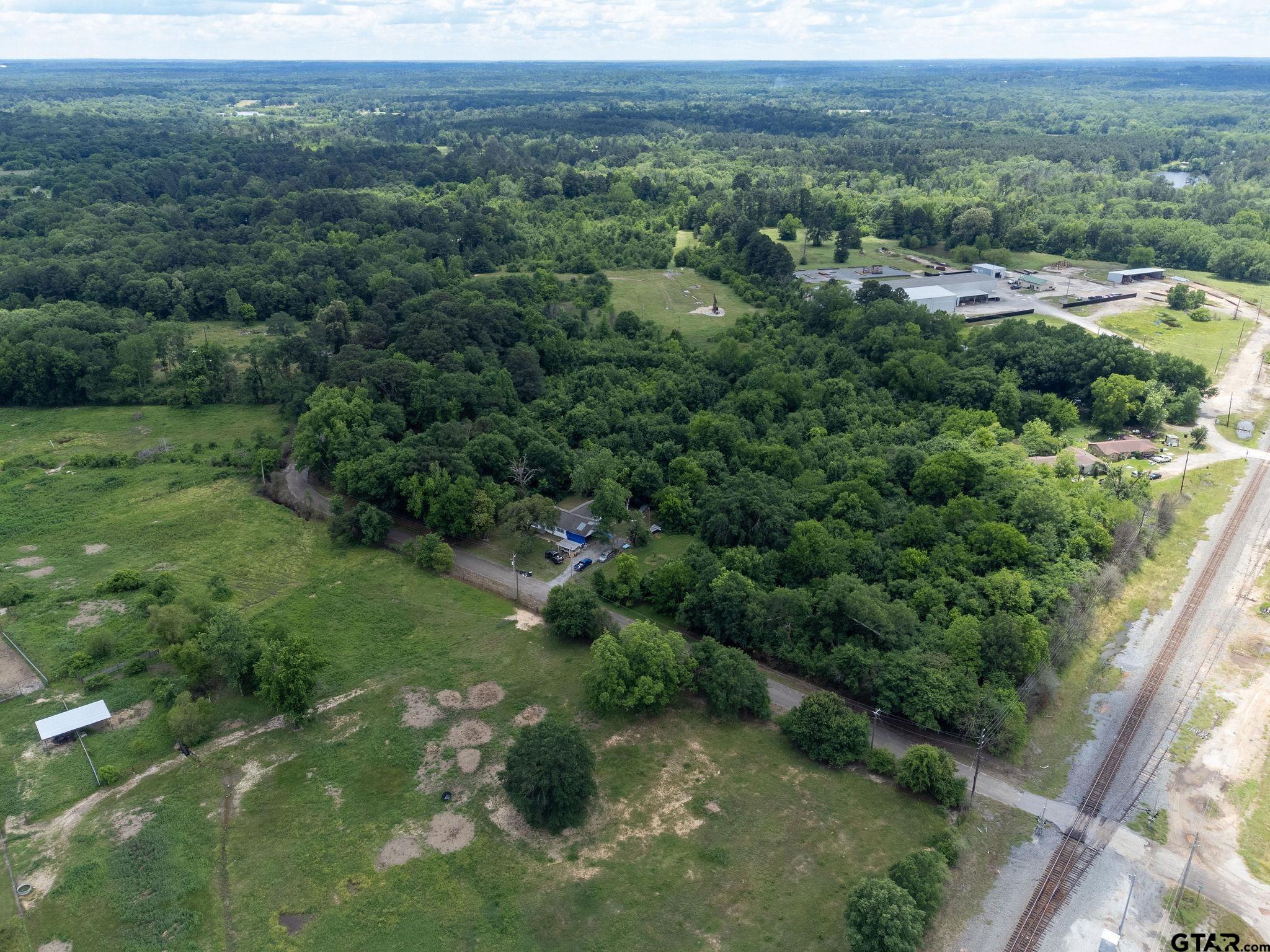 Tbd Dancinger Road Longview, TX 75603 - Photo 11 of 21 an aerial view of residential houses with outdoor space and trees