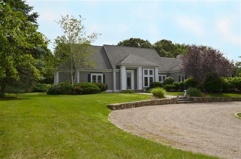 1480 South County Road Osterville, MA 02655 - Photo 1 of 12 a view of a house with a swimming pool
