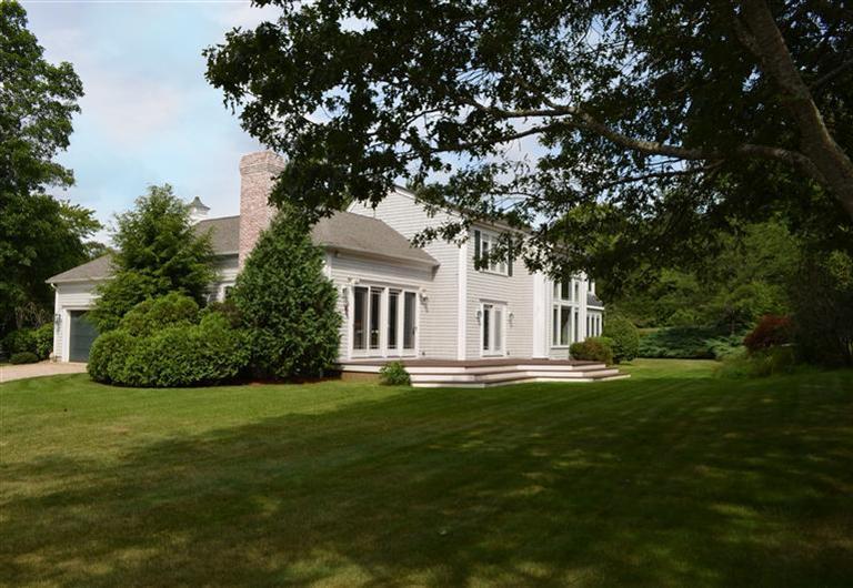 1480 South County Road Osterville, MA 02655 - Photo 12 of 12 a front view of a house with a garden