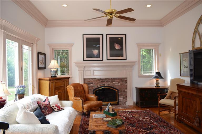1480 South County Road Osterville, MA 02655 - Photo 5 of 12 a living room with furniture a fireplace and a flat screen tv