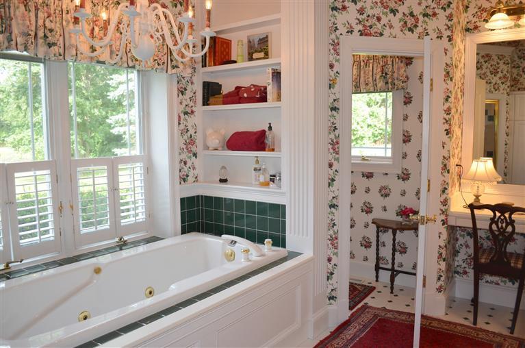 1480 South County Road Osterville, MA 02655 - Photo 8 of 12 a bathroom with a bathtub a sink and a shower