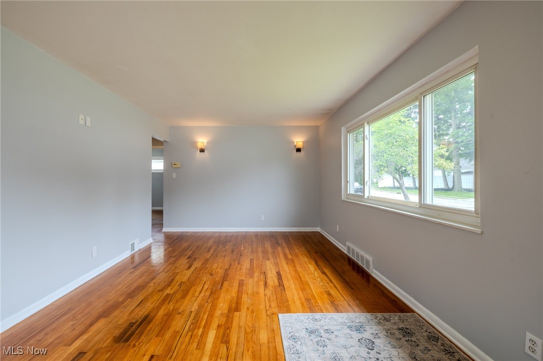 29971 Regent Road Wickliffe, OH 44092 - Photo 11 of 39 Unfurnished room with light wood-style flooring and baseboards