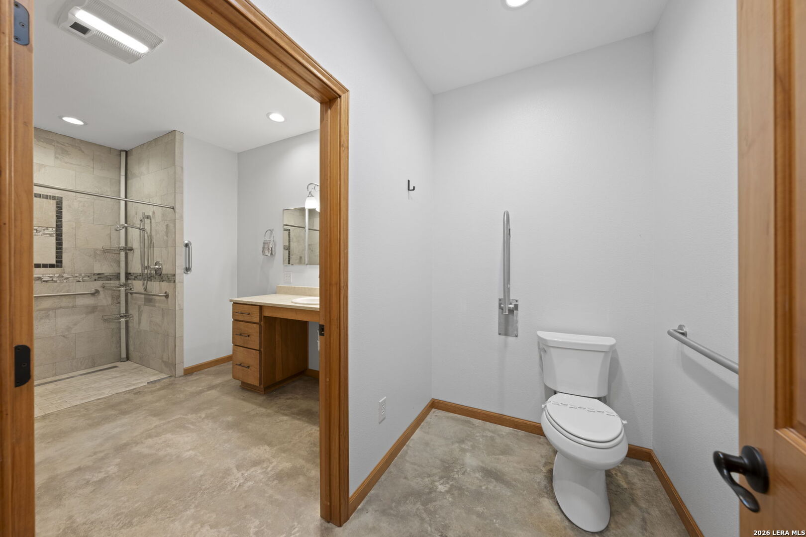2269 Old Rocksprings Road Leakey, TX 78873 - Photo 16 of 50 a bathroom with a toilet a sink and shower