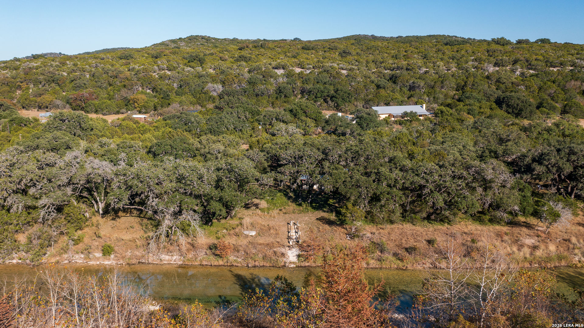 2269 Old Rocksprings Road Leakey, TX 78873 - Photo 48 of 50 a view of a lake with mountains in the background