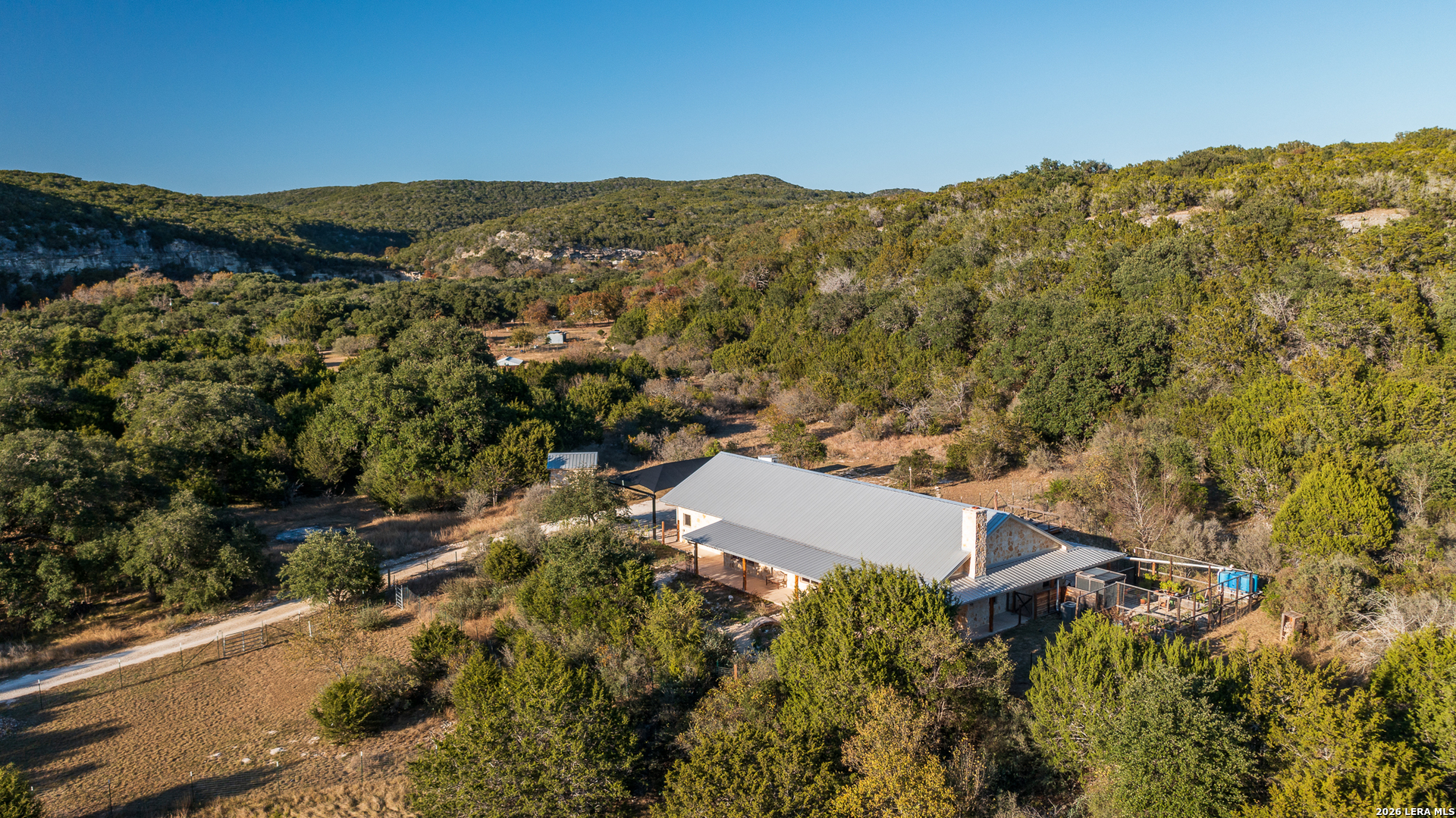 2269 Old Rocksprings Road Leakey, TX 78873 - Photo 6 of 50 an aerial view of mountain with residential house and mountain view