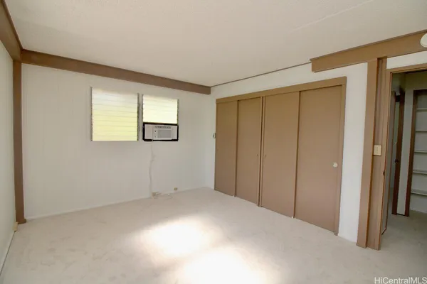 a view of empty room with windows
