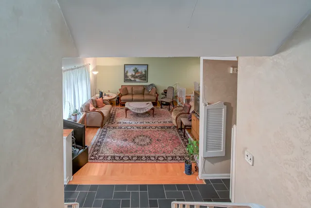 a living room with furniture and a table