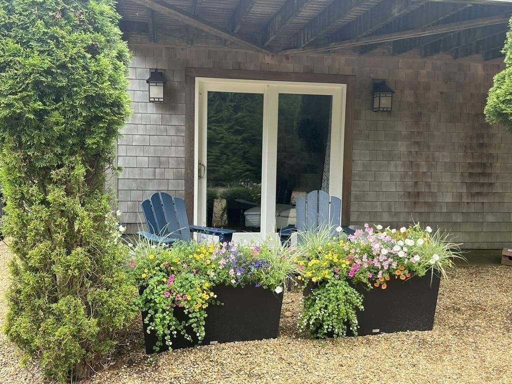 13 Young Street Edgartown, MA 02539 - Photo 22 of 29 a view of a garden with a chair