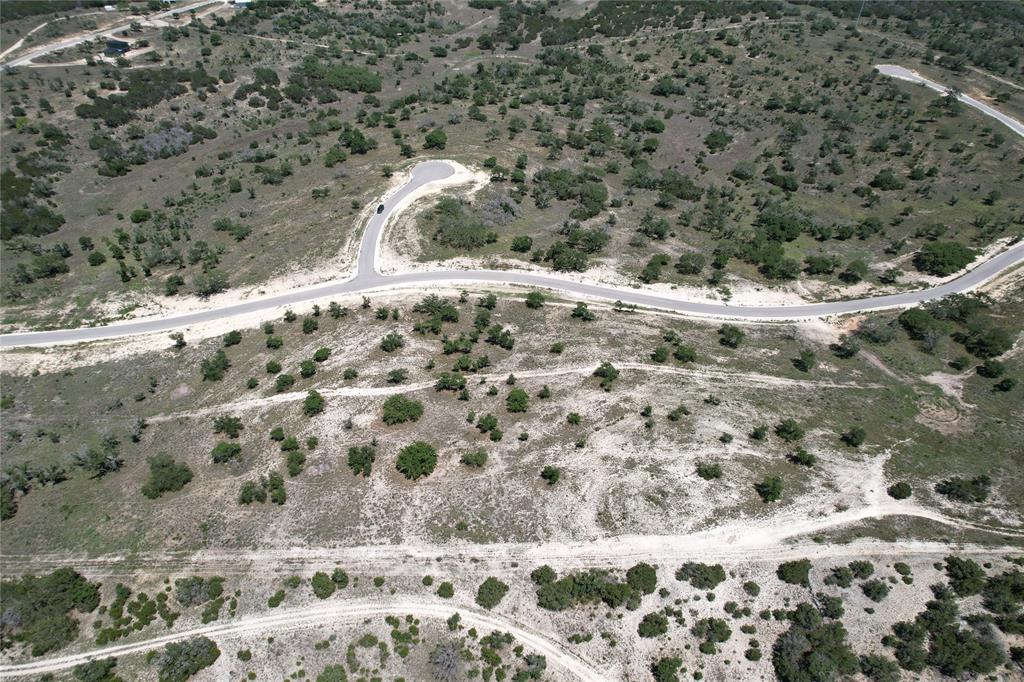 Tbd Tbd Winn Ranch Way Kerrville, TX 78028 - Photo 3 of 26 a view of a dry yard with wooden fence
