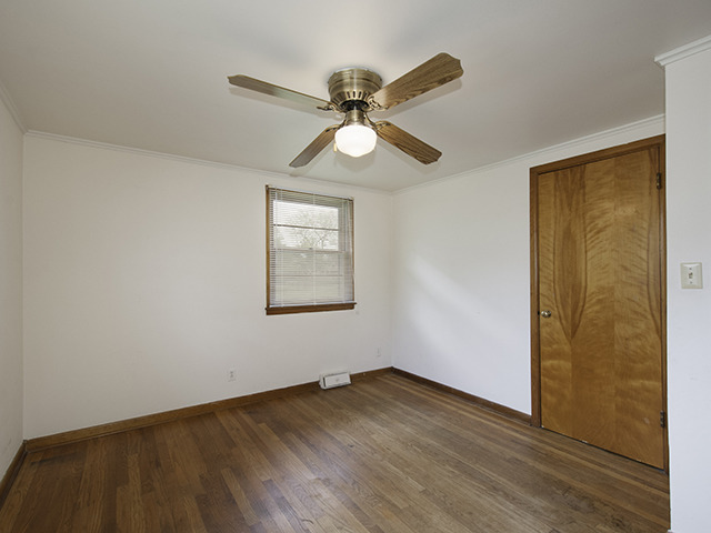 1685 Sheffer Road Aurora, IL 60505 - Photo 12 of 15 a view of empty room with wooden floor and fan