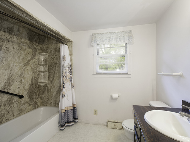 1685 Sheffer Road Aurora, IL 60505 - Photo 13 of 15 a bath room with a toilet and a bath tub