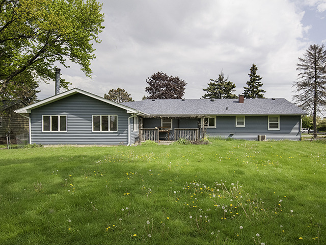 1685 Sheffer Road Aurora, IL 60505 - Photo 15 of 15 a front view of a house with a garden