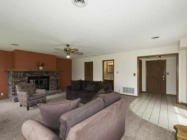1685 Sheffer Road Aurora, IL 60505 - Photo 7 of 15 a living room with furniture and a fireplace