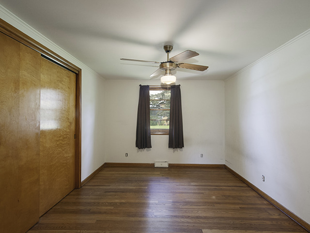 1685 Sheffer Road Aurora, IL 60505 - Photo 10 of 15 wooden floor in an empty room with a window