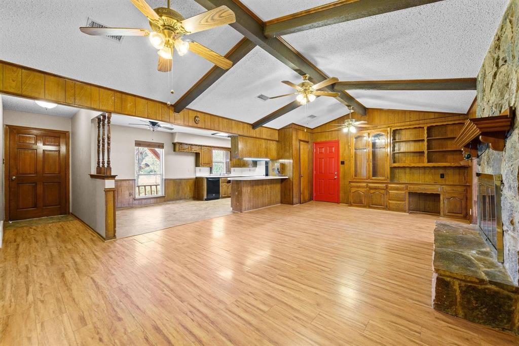 1006 South Clark Road Cedar Hill, TX 75104 - Photo 13 of 29 a view of a room with wooden floor and a ceiling fan