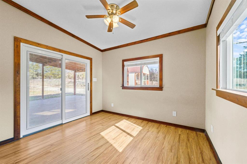 1006 South Clark Road Cedar Hill, TX 75104 - Photo 19 of 29 a view of empty room with wooden floor and fan